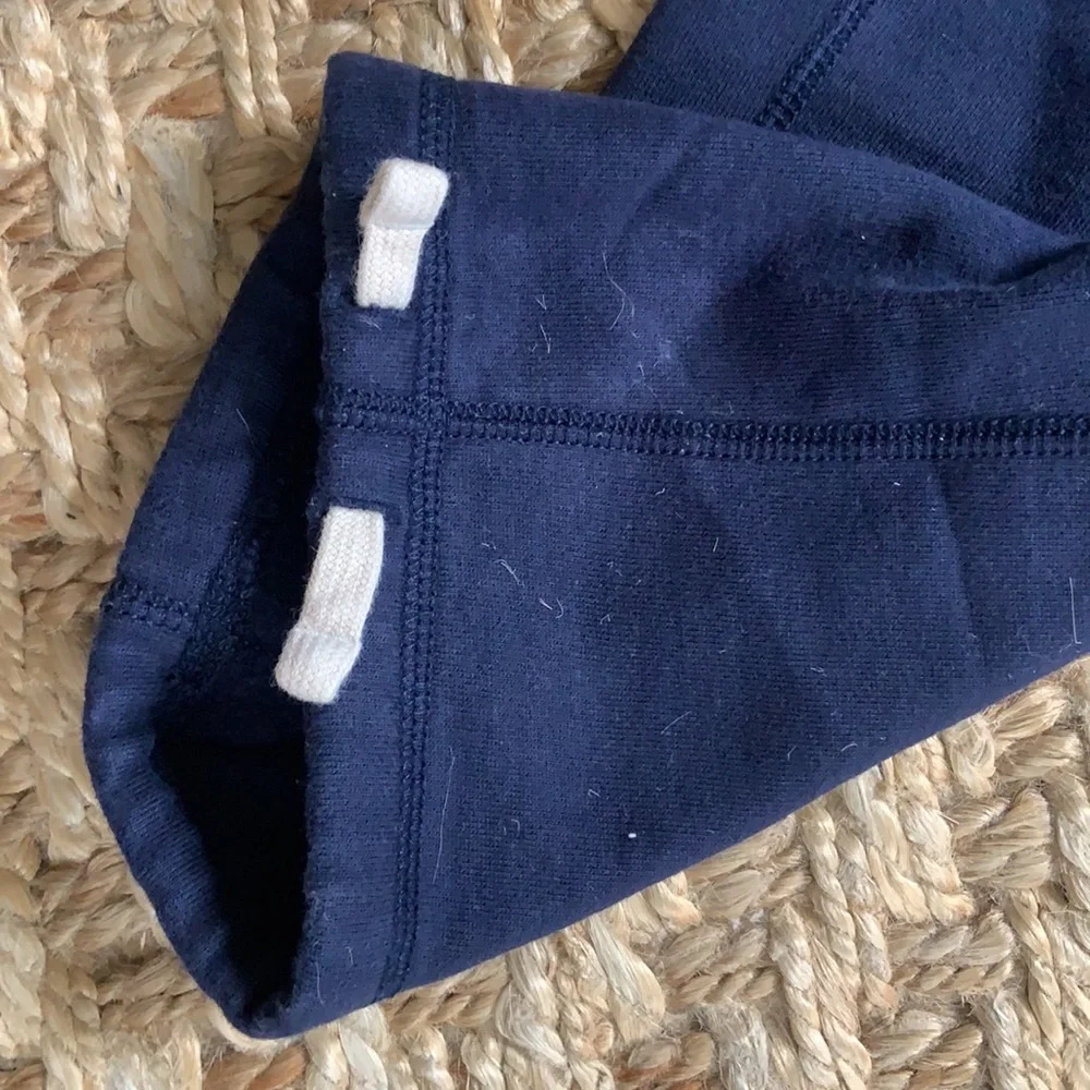 Polo navy sweatpants, two pockets, one in back, toes on the ankles.